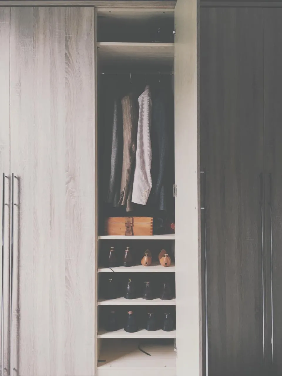 Open wardrobe with a hanging rail, shelves and shoe storage